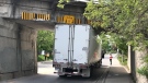 A truck stuck under the Park Street rail bridge is seen on May 16, 2022. (Dave Pettitt/CTV Kitchener)