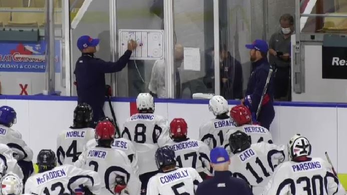 Kitchener Rangers players listen in during a huddle while they practice. (File Photo)