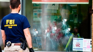 Investigators work the scene of a shooting at a supermarket in Buffalo, N.Y., Monday, May 16, 2022. (AP Photo/Matt Rourke)