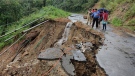 People inspect the area of a landslide after heavy rainfall in Dima Hasao district, in the northeastern Indian state of Assam, May 16, 2022. (Dima Hasao district administration via AP)