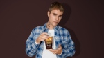 Tim Hortons and Justin Bieber are back with a new French vanilla-flavoured coffee. THE CANADIAN PRESS/Handout-Tim Hortons