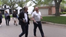 PC Candidate Paul Paolatto (R) and Coun. Steve Lehman canvas door to door on May 16, 2022. (Daryl Newcombe/CTV News London)