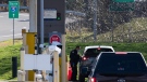 A U.S. Customs and Border Protection officer speaks to a British Columbia motorist at the Peace Arch border crossing in Blaine, Wash., across the Canada-U.S. border from Surrey, B.C., on Monday, Nov. 8, 2021. THE CANADIAN PRESS/Darryl Dyck