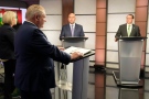 Ontario PC Party Leader Doug Ford, second from left, reads from his prepared notes as, from left to right, Ontario NDP Leader Andrea Horwath, Ontario Liberal Party Leader Steven Del Duca and Green Party of Ontario Leader Mike Schreiner debate during the Ontario party leaders' debate, in Toronto, Monday, May 16, 2022. THE CANADIAN PRESS/Frank Gunn
