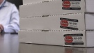 Antonino's Original Pizza boxes from Windsor, Ont., are pictured in Victoria, B.C.