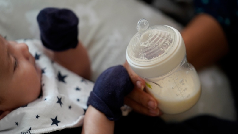 Giving an infant a bottle of baby formula in San Antonio, Texas, on May 13, 2022. (Eric Gay / AP) 