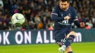 Lionel Messi takes a free kick during a French League One soccer match between Paris Saint Germain and Lens at Parc des Princes stadium in Paris, on April 23, 2022. (Michel Euler / AP)