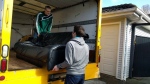 In this photo from the organization's Facebook page, volunteers with Homestart unload furniture. 