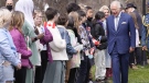 Prince Charles greets well-wishers in St. John's as the Royal couple arrives for a visit to Canada on May 17, 2022. (Paul Chiasson / THE CANADIAN PRESS)