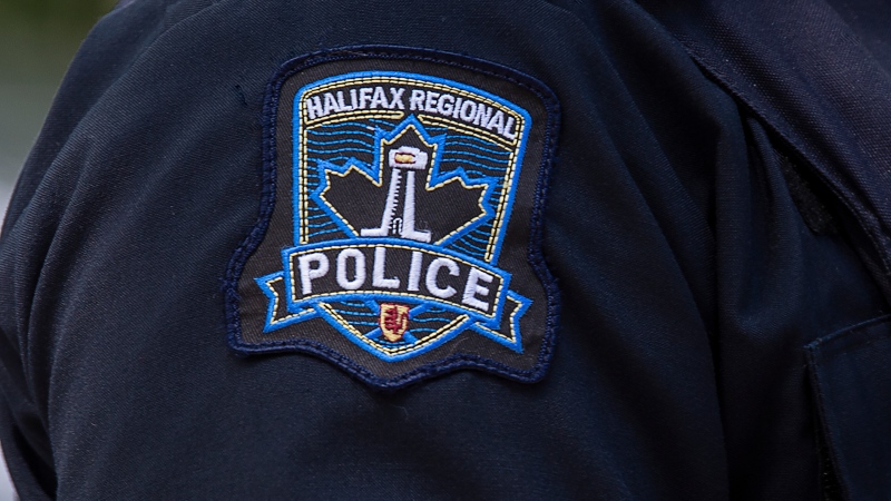 A Halifax Regional Police emblem is seen as police officers attend a murder scene in Halifax on Thursday, July 2, 2020. THE CANADIAN PRESS/Andrew Vaughan 
