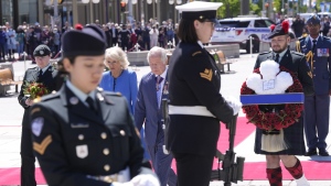 Prince Charles and Camilla, Duchess of Cornwall, visit the National War Memorial in Ottawa, on May 18, 2022. (Paul Chiasson / THE CANADIAN PRESS)