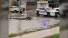 What appears to be clothing and a damaged bicycle are seen at the intersection of Erin Street and Sargent Avenue where police say there was a crash with a garbage truck on May 18, 2022. (Source: Gary Robson/CTV News)