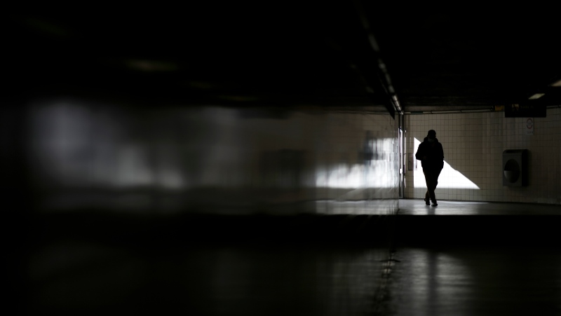 A man enters a subway station in Lisbon, Thursday, Jan. 6, 2022. (AP Photo/Armando Franca)