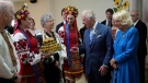 Prince Charles and Camilla, Duchess of Cornwall, are presented with bread and salt during a visit to a Ukrainian church in Ottawa on their Canadian Royal Tour, Wednesday, May 18, 2022. (Paul Chiasson/THE CANADIAN PRESS)