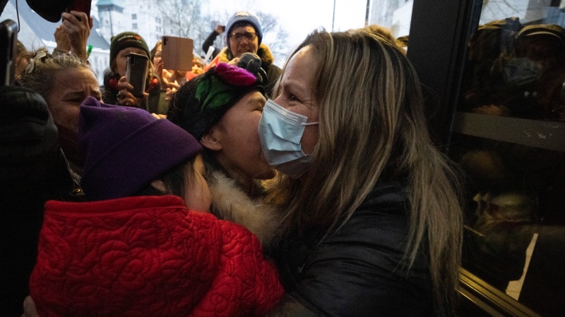 Tamara Lich, an organizer of the so-called Freedom Convoy who organized fundraising for the protest which became a weeks long blockade, embraces supporters as she leaves the courthouse in Ottawa after being granted bail, on Monday, March 7, 2022. THE CANADIAN PRESS/Justin Tang