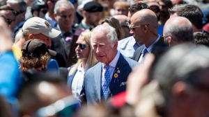 Prince Charles greets members of the public during a visit to the ByWard Market in Ottawa, during their Canadian Royal tour, on Wednesday, May 18, 2022. (Justin Tang/THE CANADIAN PRESS)