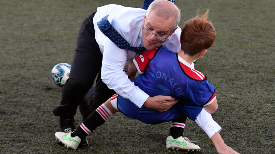 Australian PM tackles kid during soccer match