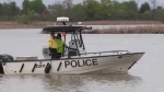 An OPP boat searches the Grand River in Dunnville, Ont. after the remains of a young girl were found. (May 18, 2022)