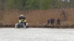 OPP search and rescue teams at the Grand River in Dunnville, Ont. the day after the remains of a young girl were found in the water. (May 18, 2022)
