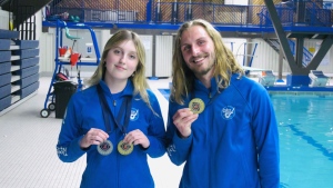 Bronte Cawkwell and Jacob Korpan with their goal medals from the Senior Mixed Duet event. (Brit Dort/CTV News Regina)