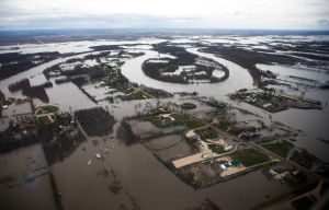 The Red River overflows its banks south of Winnipeg, Sunday, May 15, 2022. THE CANADIAN PRESS/John Woods