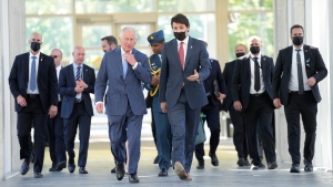 Prince Charles walks with Prime Minister Justin Trudeau as they arrive for sustainable finance roundtable meeting in Ottawa as part of the Canadian Royal Tour, Wednesday, May 18, 2022. (Paul Chiasson/THE CANADIAN PRESS)