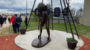 A statue of Indigenous hockey trailblazer Fred Sasakamoose is pictured outside SaskTel Centre. (Nicole Di Donato/CTV Saskatoon)