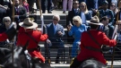 Prince Charles and Camilla, Duchess of Cornwall, watch a performance of the RCMP Musical Ride in Ottawa during their Canadian tour, May 18, 2022. THE CANADIAN PRESS/Justin Tang
