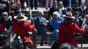 Prince Charles and Camilla, Duchess of Cornwall, watch a performance of the RCMP Musical Ride in Ottawa during their Canadian tour, May 18, 2022. THE CANADIAN PRESS/Justin Tang