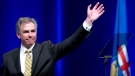 Outgoing Premier Jim Prentice waves after his speech at the Alberta PC Dinner in Calgary, Alberta on Thursday May 14, 2015. THE CANADIAN PRESS/Larry MacDougal