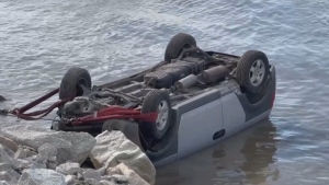 A driver had minor injuries after flipping their vehicle into the Fraser River Wednesday.