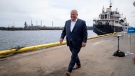 Premier Doug Ford walks away after making an announcement on the with Stelco as a backdrop during an election campaign stop in Hamilton, Ont. on Wednesday, May 18, 2022. THE CANADIAN PRESS/Peter Power