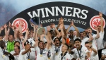 Frankfurt players celebrate with the trophy after winning the Europa League final soccer match between Eintracht Frankfurt and Rangers FC at the Ramon Sanchez Pizjuan stadium in Seville, Spain, Wednesday, May 18, 2022.  (AP Photo/Manu Fernandez)