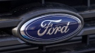 Ford Motor Company's blue oval logo is shown at a dealership in east Denver in this Sunday, April 25, 2021, photograph. (AP Photo/David Zalubowski, File)