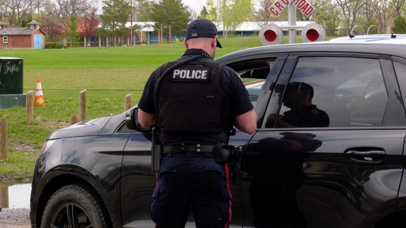 A police officer is pictured at a check-stop in Saskatoon on May 19, 2022. (Twitter/Saskatoon Police Service)