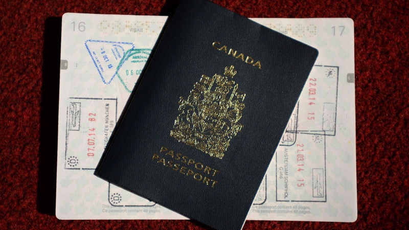 A Canadian Passport is displayed in Ottawa on Thursday, July 23, 2015. THE CANADIAN PRESS/Sean Kilpatrick
