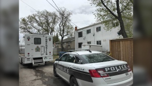 Winnipeg police are parked outside a building on McKay Avenue as part of an investigation into the homicide of 24-year-old Rebecca Contois on May 19, 2022. Contois' partial remains were discovered outside of an apartment building on May 16. (CTV News Photo Josh Crabb)