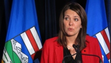 Alberta Wildrose leader Danielle Smith tells reporters in Calgary, Tuesday, Oct.28, 2014. THE CANADIAN PRESS/Bill Graveland