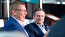 Saskatchewan Premier Scott Moe laughs as Alberta Premier Jason Kenney looks on during a joint panel discussion held in the Weyburn Curling Rink at the Saskatchewan Oil & Gas Show in Weyburn, Sask. on Wednesday June 5, 2019. THE CANADIAN PRESS/Michael Bell