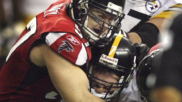 Pittsburgh Steelers quarterback Ben Roethlisberger is hit by Atlanta Falcons defensive end Patrick Kerney in Atlanta, Sunday, Oct. 22, 2006. Roethlisberger left the game with a head injury. (AP/Atlanta Journal Constitution, Curtis Compton)