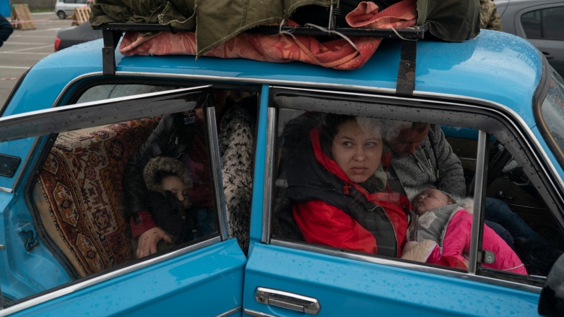 Internally displaced people from Mariupol and nearby towns arrive at a refugee centRE fleeing from the Russian attacks, in Zaporizhzhia, Ukraine, Thursday, April 21, 2022. (AP Photo/Leo Correa)