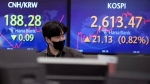 A currency trader watches monitors at the foreign exchange dealing room of the KEB Hana Bank headquarters in Seoul, South Korea, on May 20, 2022. (Ahn Young-joon / AP) 