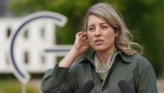 Melanie Joly, Foreign Minister of Canada, addresses the media during a statement as part of the meeting of foreign ministers of the G7 Group of leading democratic economic powers at the Weissenhaus resort in Weissenhaeuser Strand, Germany, Saturday, May 14, 2022. (Marcus Brandt/Pool via AP)