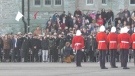 Cadets stand for a moment of silence at the Royal Military College in Kingston, Ont. on Thursday to remember four cadets killed in an incident last month. (Kimberley Johnson/CTV News Ottawa.
