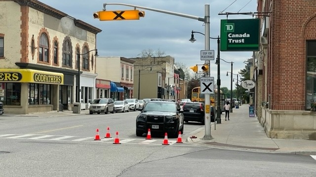 Lambton County OPP remain on scene at the intersection of Petrolia Line and Greenfield Street in Petrolia after a woman in her 30s was struck by a vehicle on May 20, 2022. (Gerry Dewan/CTV News London)