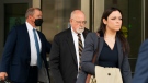 Special counsel John Durham, center, the prosecutor appointed to investigate potential government wrongdoing in the early days of the Trump-Russia probe, leaves federal courthouse in Washington, Monday, May 16, 2022. (AP Photo/Manuel Balce Ceneta)