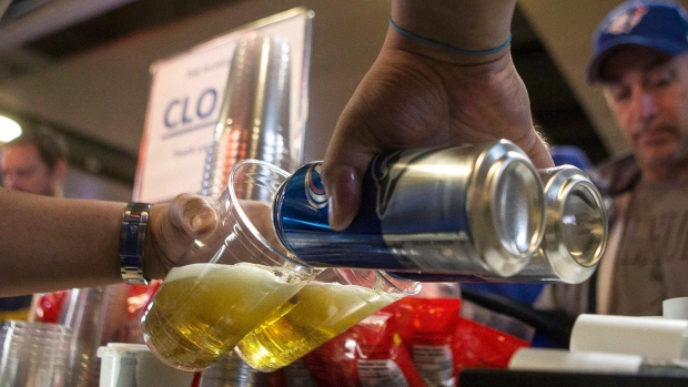 Canned beers are poured into a plastic glass at a vending stand at the Rogers Centre in Toronto on Sunday, October 9, 2016. THE CANADIAN PRESS/Chris Young