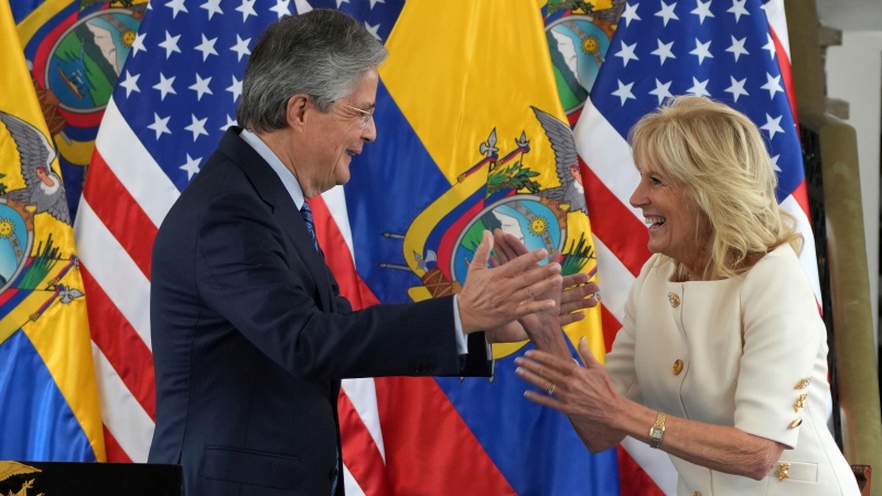 Ecuador's President Guillermo Lasso motions to embrace U.S. first lady Jill Biden after delivering a speech at the Carondelet Palace in Quito, Ecuador, Thursday, May 19, 2022. (AP Photo/Dolores Ochoa)