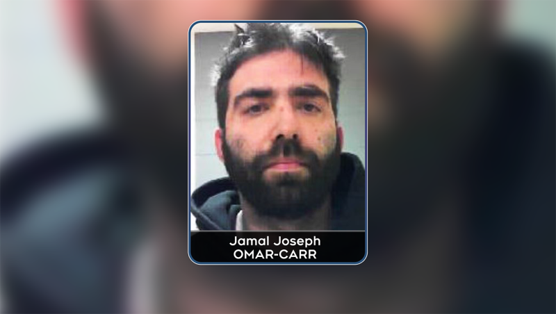Jamal Joseph Omar-Carr is charged with failing to comply with a release order and violating his probation. He's 34 years old, 5'10" and has a medium build. He also has a large, distinctive tattoo on his left arm.