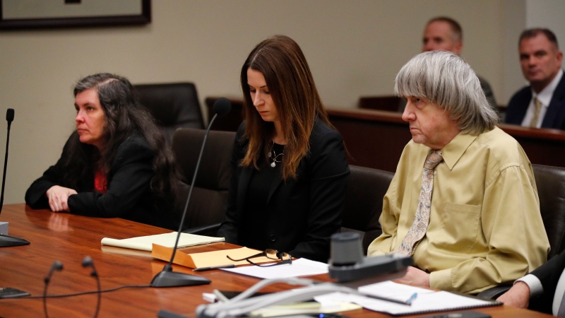 David Turpin, right, and wife, Louise, left, listen to the judge, along with attorney Allison Lowe, during a courtroom hearing, Friday, Feb. 22, 2019, in Riverside, Calif. (AP Photo/Jae C. Hong, Pool) 